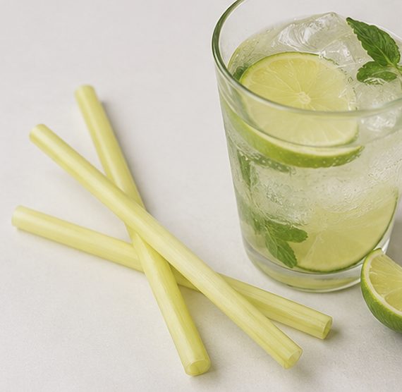 Terra Rice Straws beside a cocktail with lime and mint